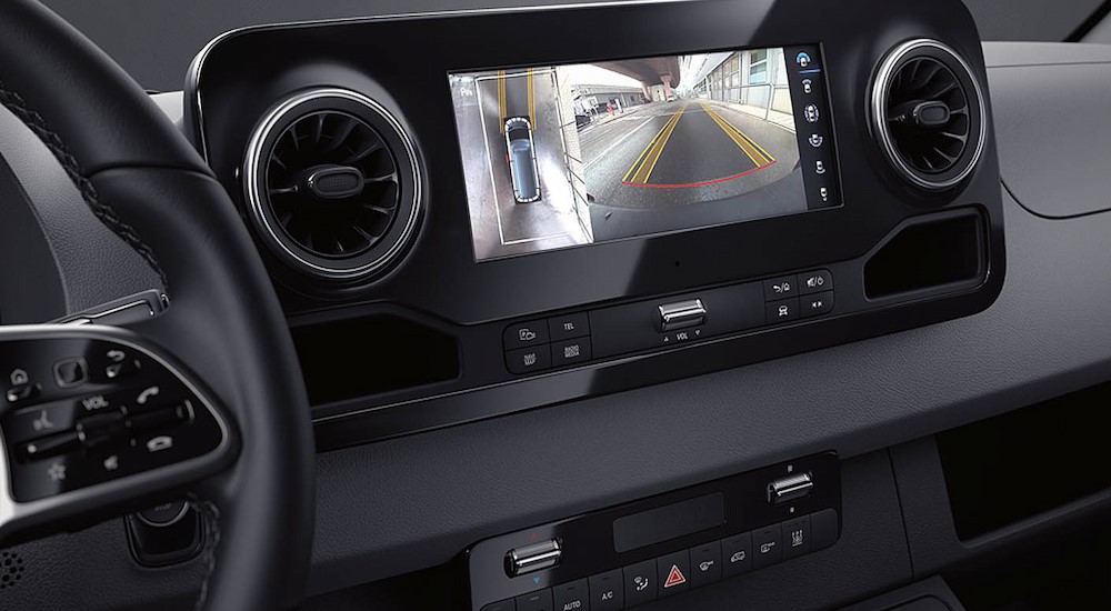 A close-up of the infotainment screen is shown in a 2024 Mercedes-Benz Sprinter 2500.