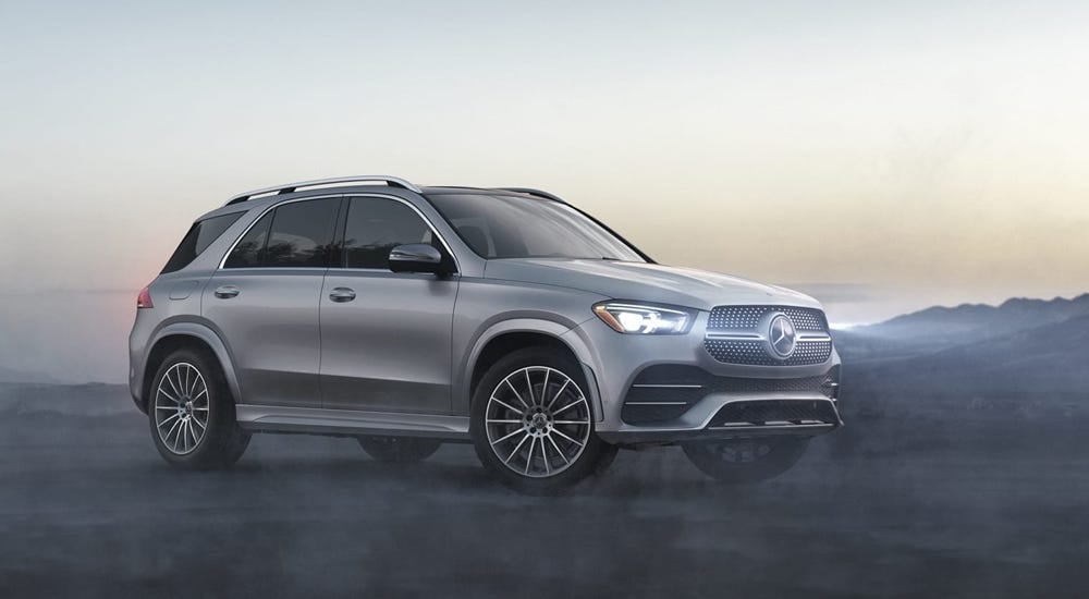 A silver 2020 Mercedes-Benz GLE parked in a foggy landscape.