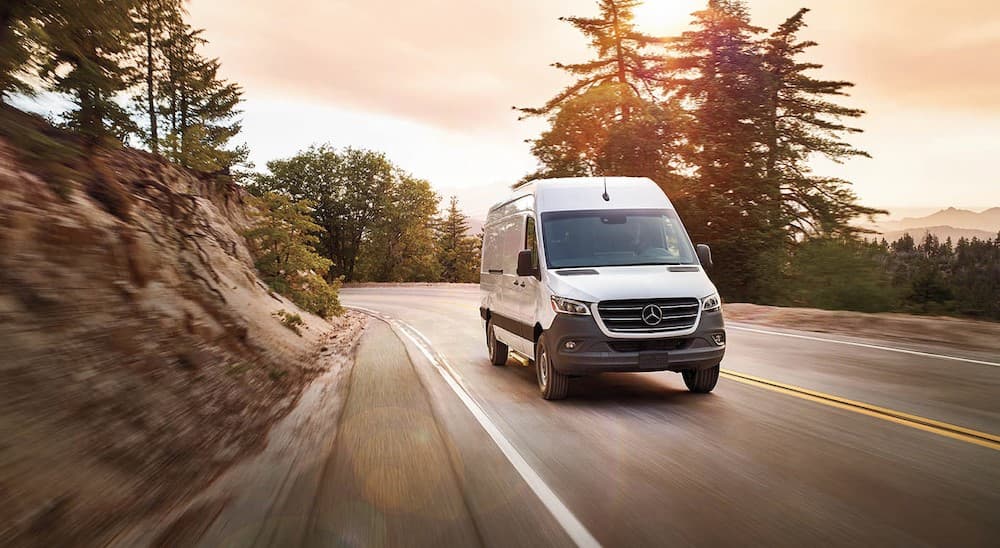 A white 2024 Mercedes-Benz Sprinter 4500 is shown driving after viewing a Mercedes-Benz Sprinter for sale near West Chester.