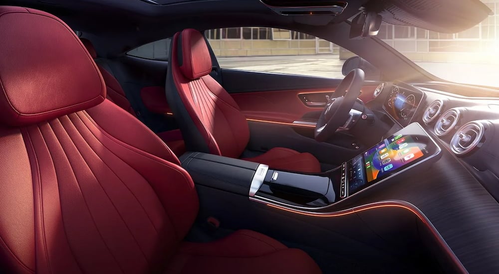 The red and black interior front seats of a 2024 Mercedes-Benz CLE 450 4MATIC.