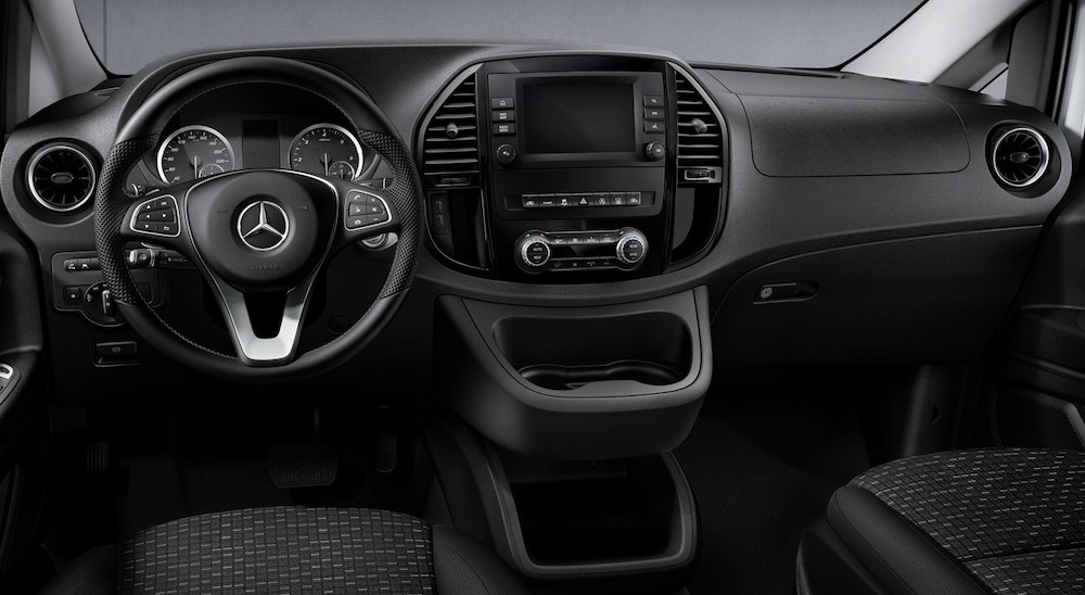 The black interior and dash is shown in a 2024 2024 Mercedes-Benz Metris.