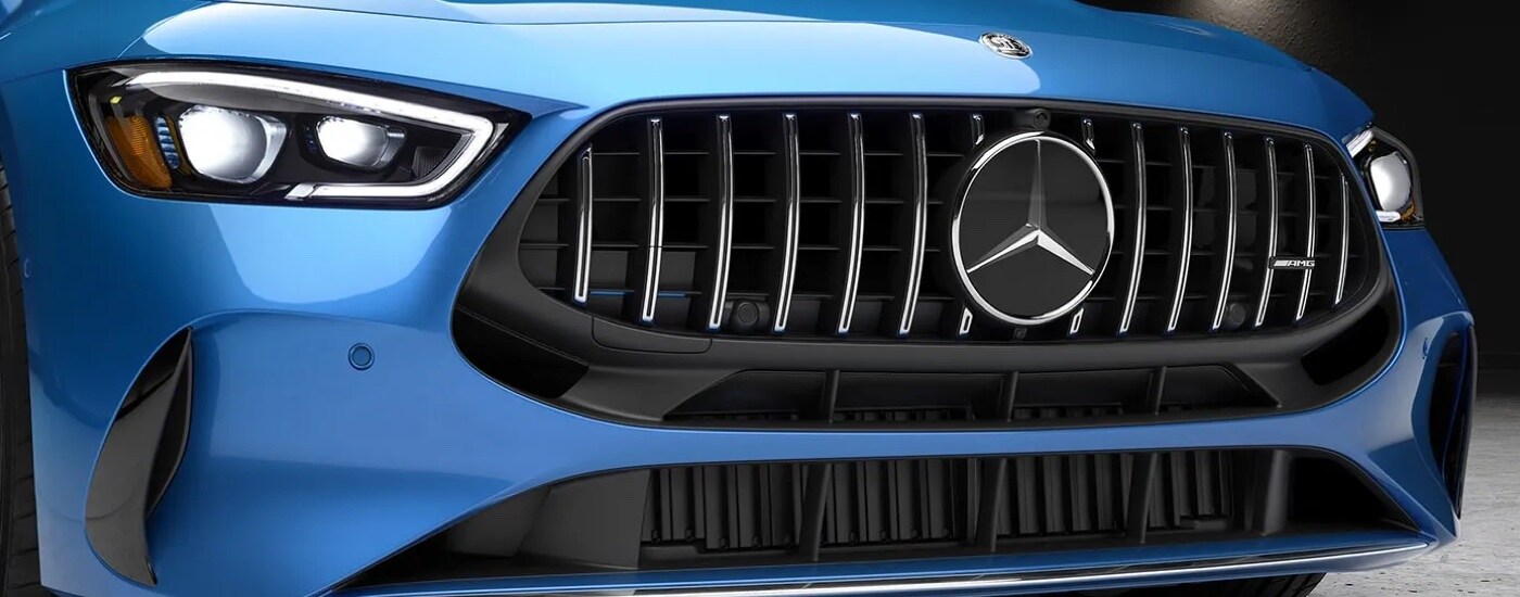 Close-up of the grille on a blue 2024 Mercedes-Benz AMG GT coupe.