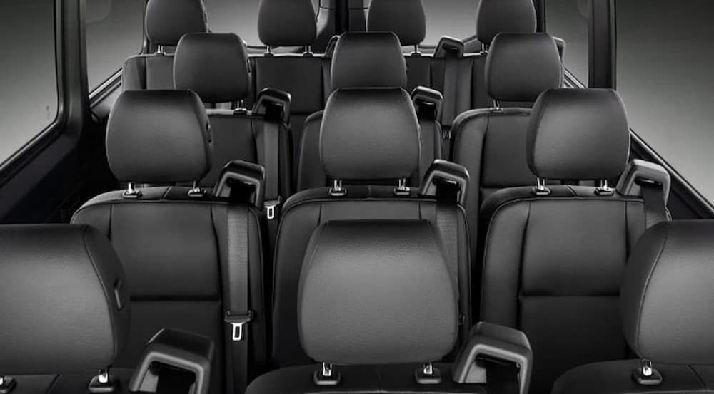 The black interior seating in a 2024 Mercedes-Benz Sprinter 4500 is shown.
