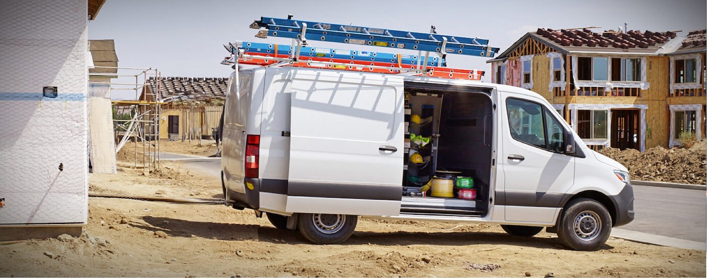 A white 2024 Mercedes-Benz Sprinter 2500 cargo van parked at a construction site.