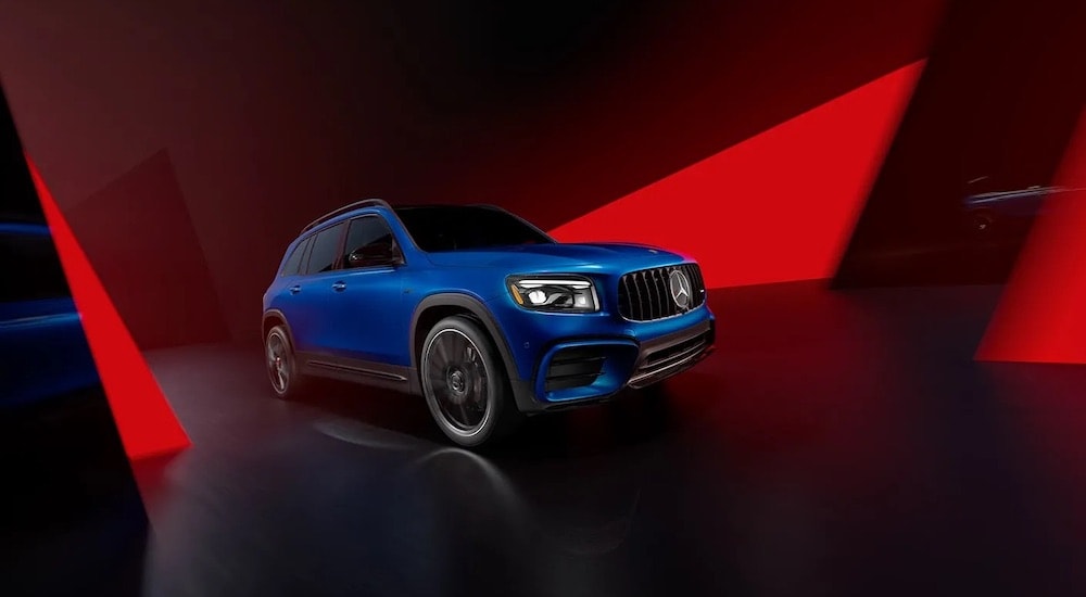 A blue 2023 Mercedes-AMG GLB is shown from the front at an angle after leaving a dealer that has a used Mercedes-Benz for sale.