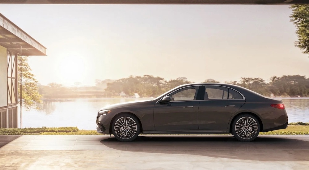 A grey 2024 Mercedes-Benz E-Class is shown from the side after leaving a Mercedes-Benz dealer near Roseburg.