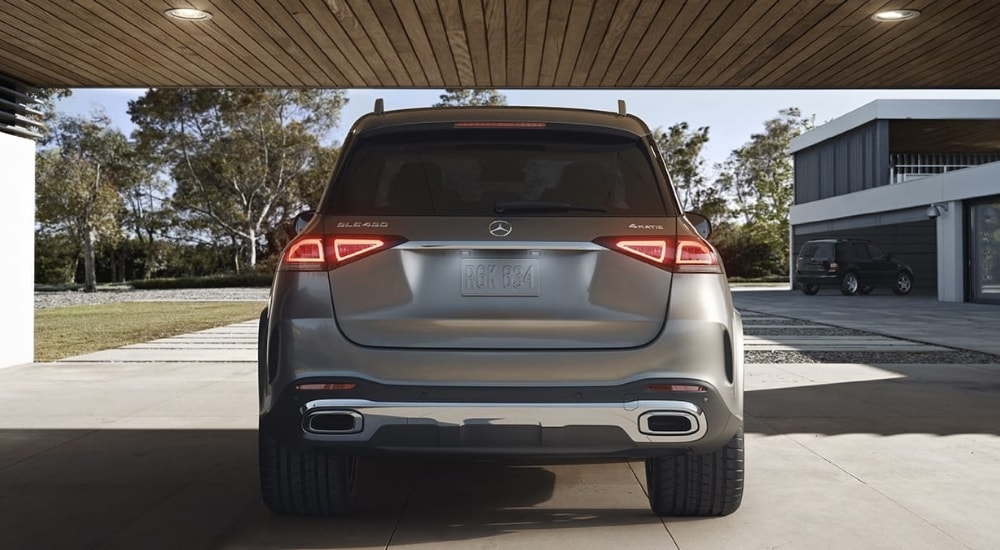 Rear view of a grey 2020 Mercedes-Benz GLE 450 parked in a garage.