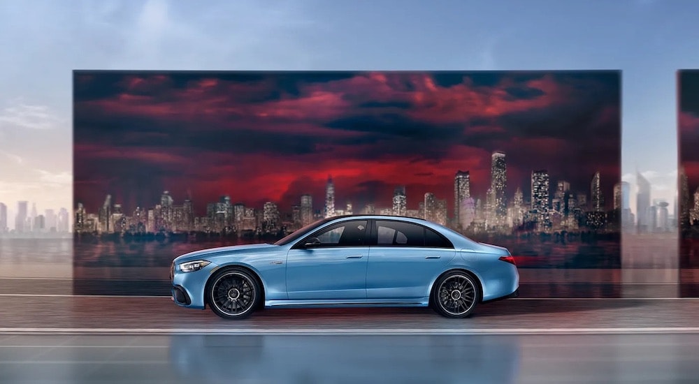 A blue 2023 Mercedes-AMG S 63 is shown from the side.