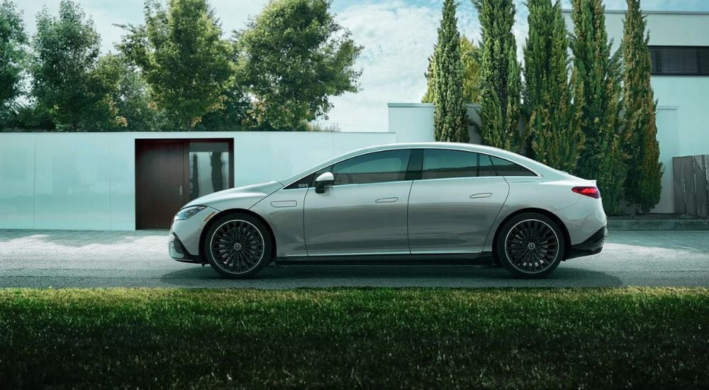 A popular used Mercedes-Benz for sale in Medford, a silver 2023 Mercedes-Benz EQE, is shown from the side.