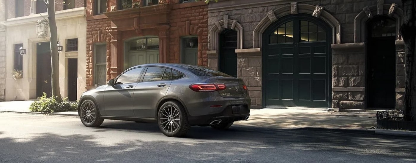 A grey 2024 Mercedes-Benz GLC is shown from the rear at an angle.