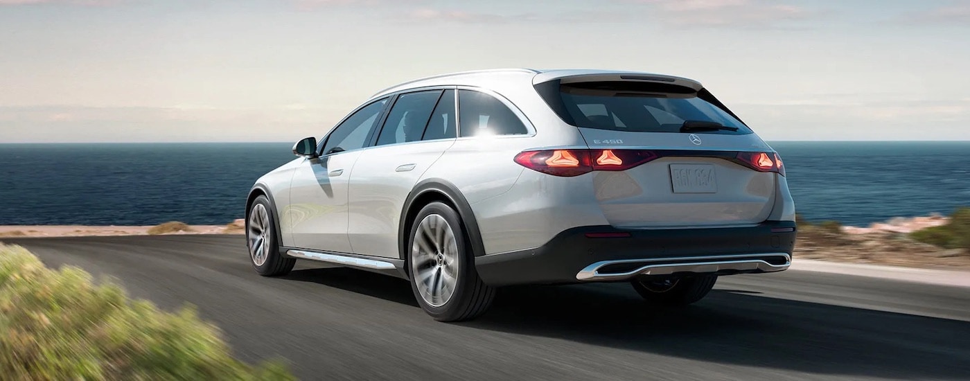 A silver 2024 Mercedes-Benz E-Class is shown from the rear at an angle.