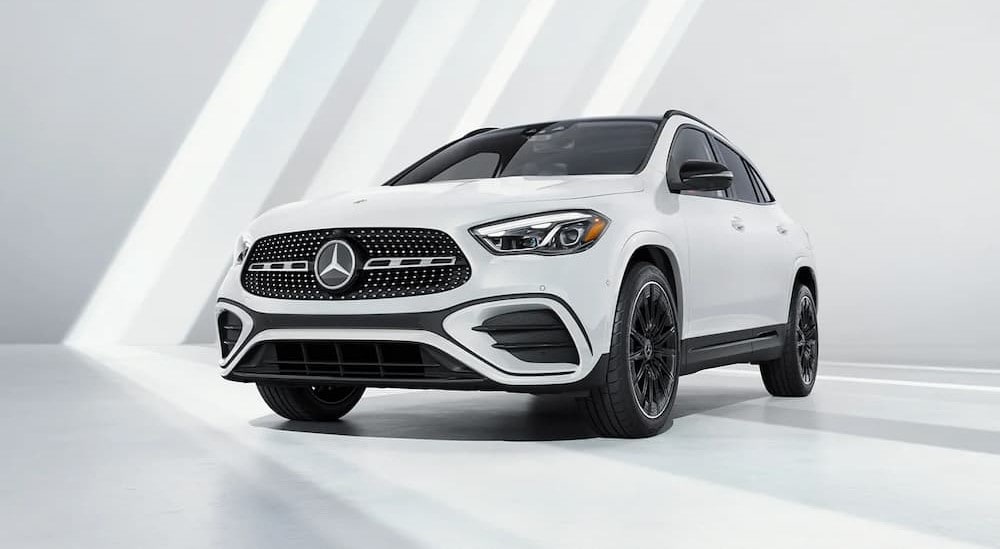 A white 2025 Mercedes-Benz GLA 250 is shown parked at a Mercedez-Benz dealer near Cottage Grove.