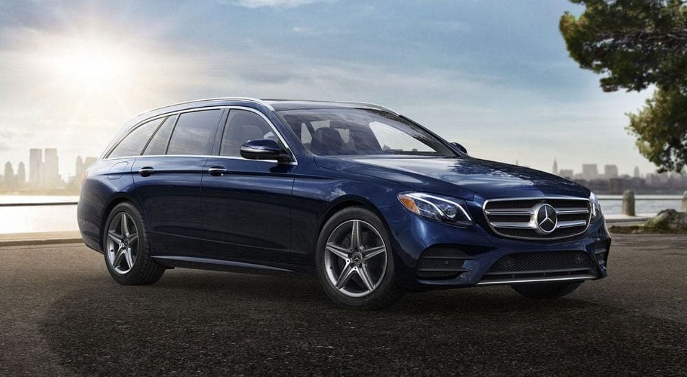 A blue 2020 Mercedes-Benz E-Class is shown on a sunny day.