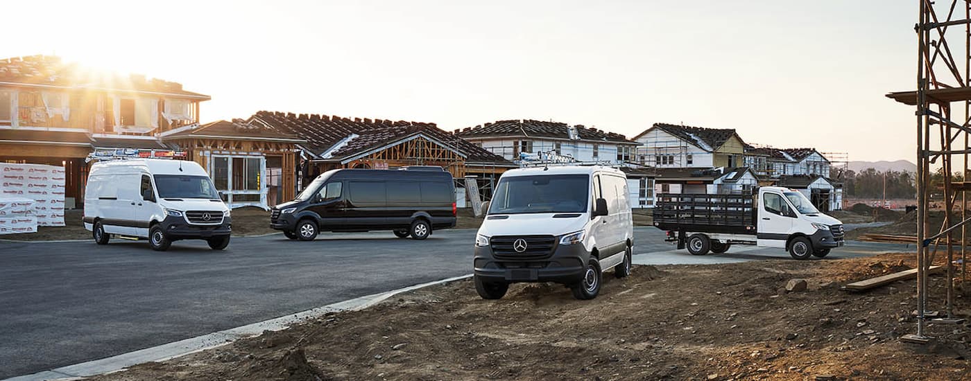 Four 2024 Mercedes-Benz Sprinter vans with a variety of upfits parked at a construction site.