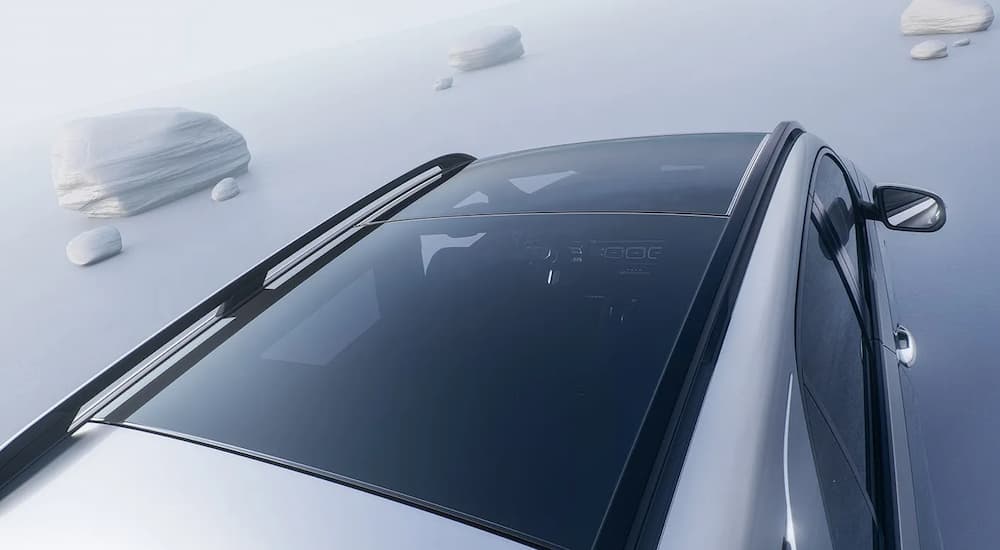 The sunroof on a silver 2025 Mercedes-Benz GLE 350 parked on a light background.