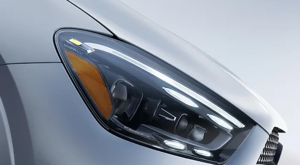 A close up of the headlight on a silver 2025 Mercedes-Benz GLE 350 for sale.