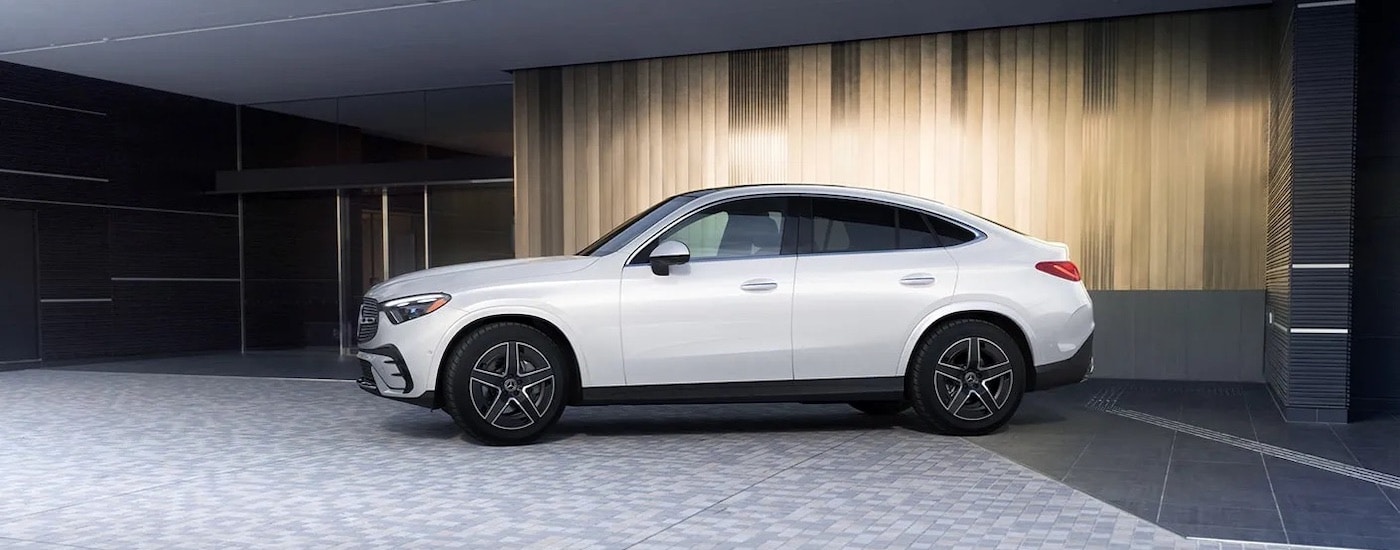 A white 2024 Mercedes-Benz GLC is shown from the side.