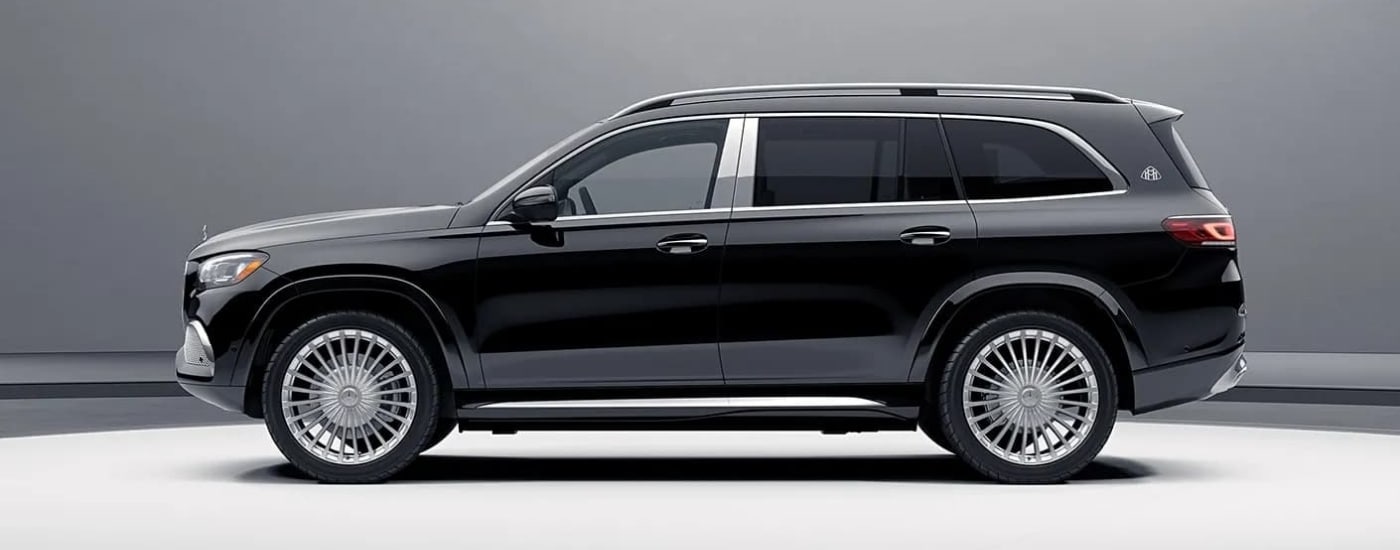 A black 2023 Mercedes-Benz Maybach GLS is shown from the side.