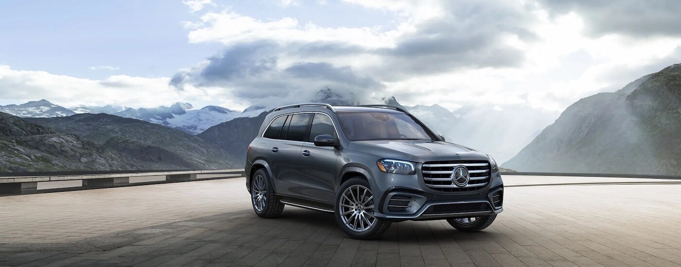 A grey 2024 Mercedes-Benz GLS is shown from the front at an angle.