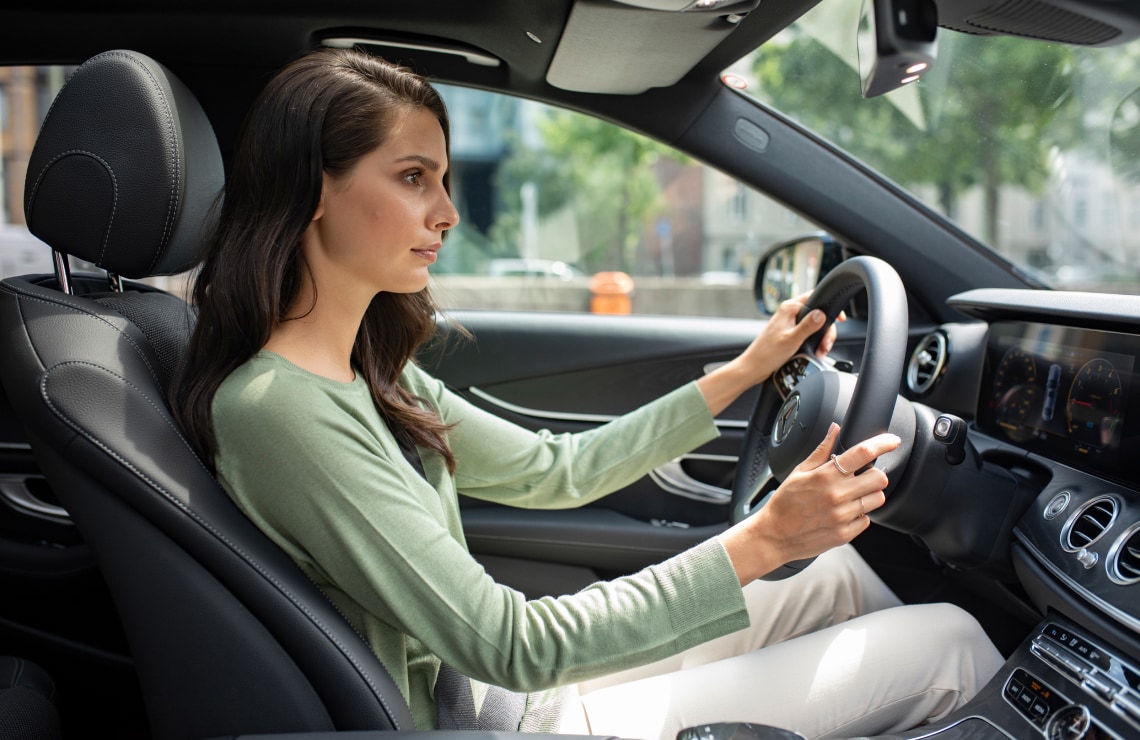 Woman driving a Mercedes-Benz