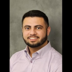 Staff member Alex Johnson from ID_941794348bae