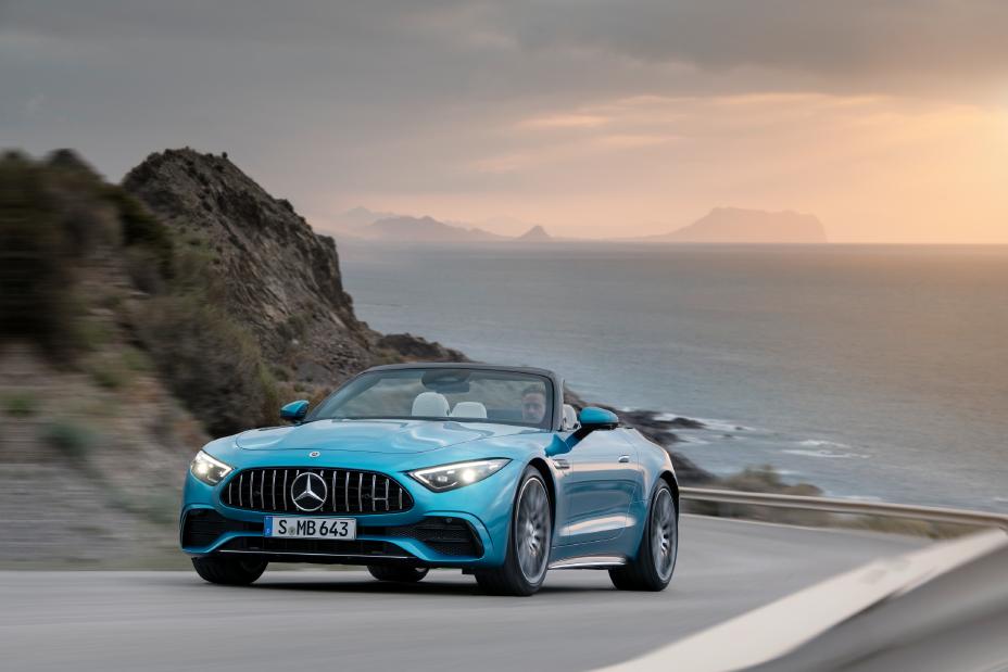 New AMG® SL 43 with New Turbo Technology driving along a coastal road.