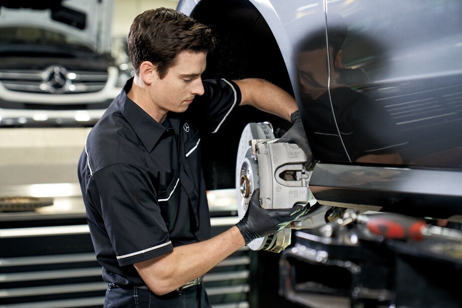 Mercedes-Benz service technician replacing brake calipers.png