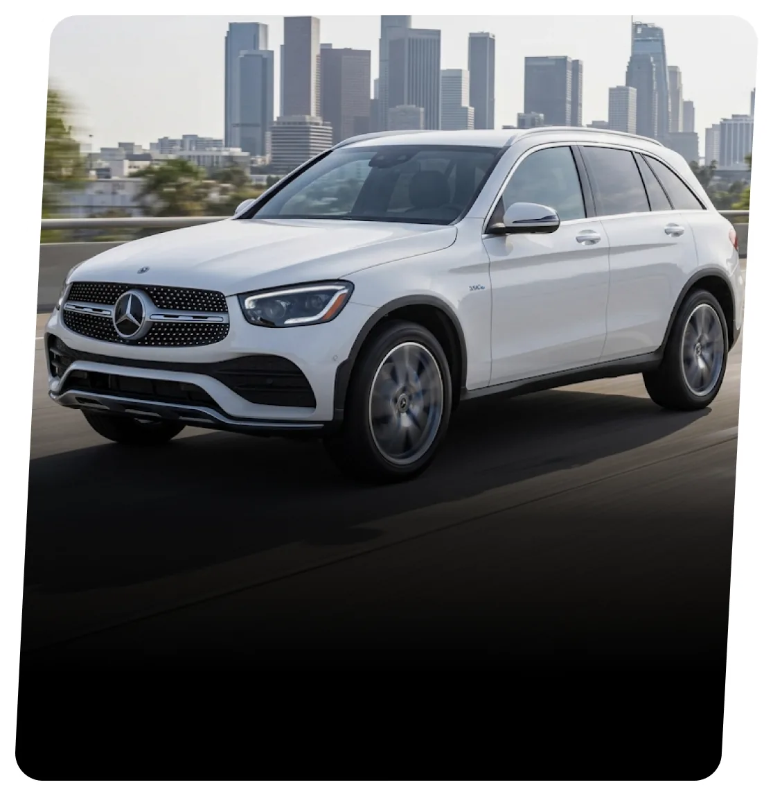 White Mercedes-Benz hybrid SUV on a highway