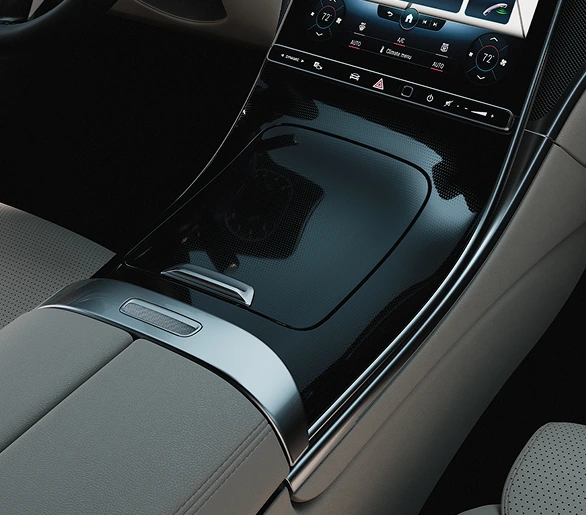 Gloss black C-Class centre console trim beside grey upholstery