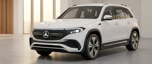 White Mercedes-Benz EQ electric SUV in a showroom