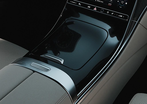 Gloss black centre console trim flowing into the C-Class dashboard beside grey upholstery