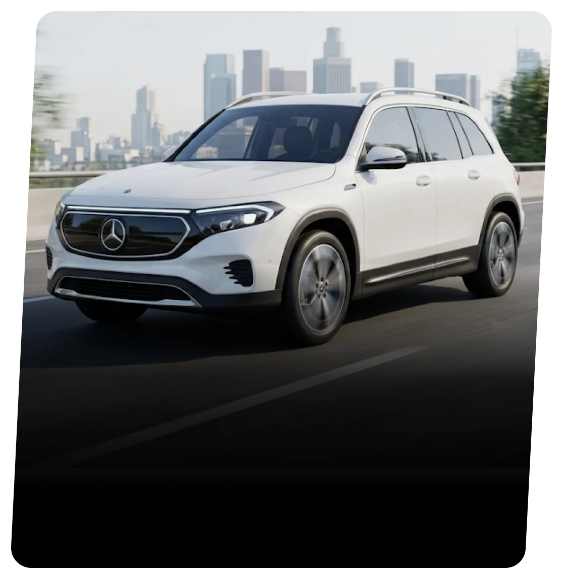 White Mercedes-Benz electric SUV on a highway