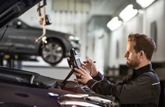 service tech marking off service checklist