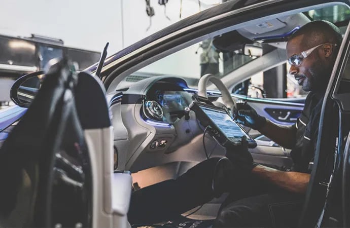 Certified Mercedes-Benz GLS technicians performing routine maintenance