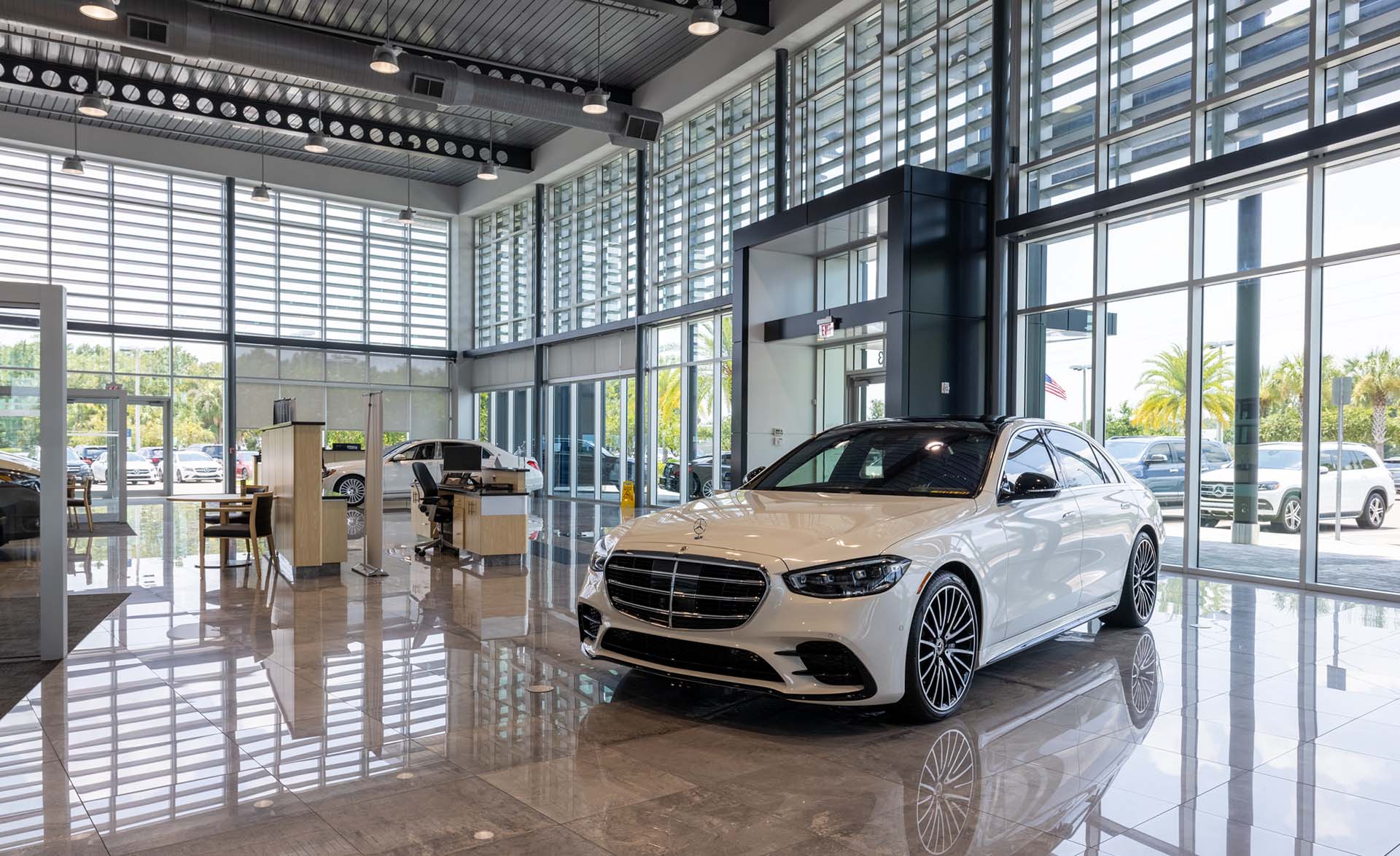 Get an auto loan near you at Mercedes-Benz of Wesley Chapel Interior view of the showroom at Mercedes-Benz of Wesley Chapel
