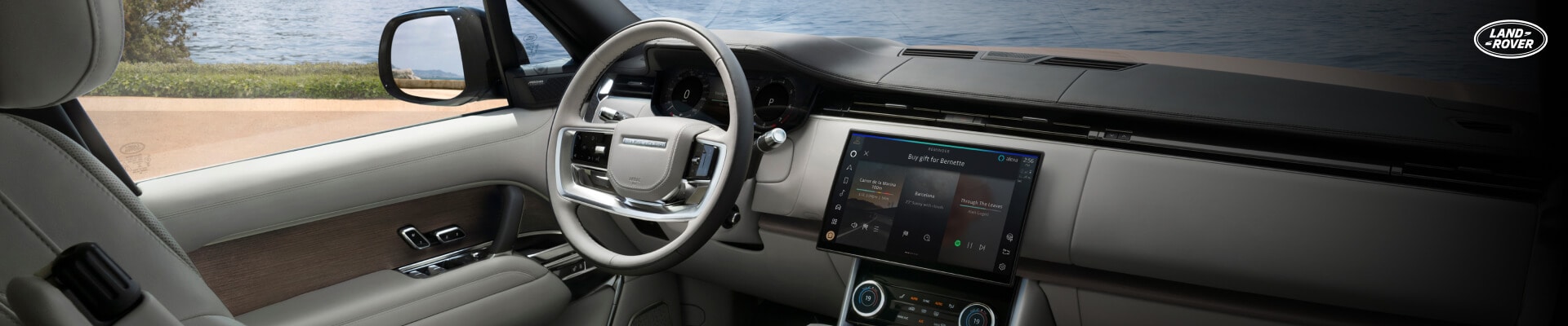Front dashboard view of a Sunset Gold Land Rover Range Rover with a Perlino leather cabin.