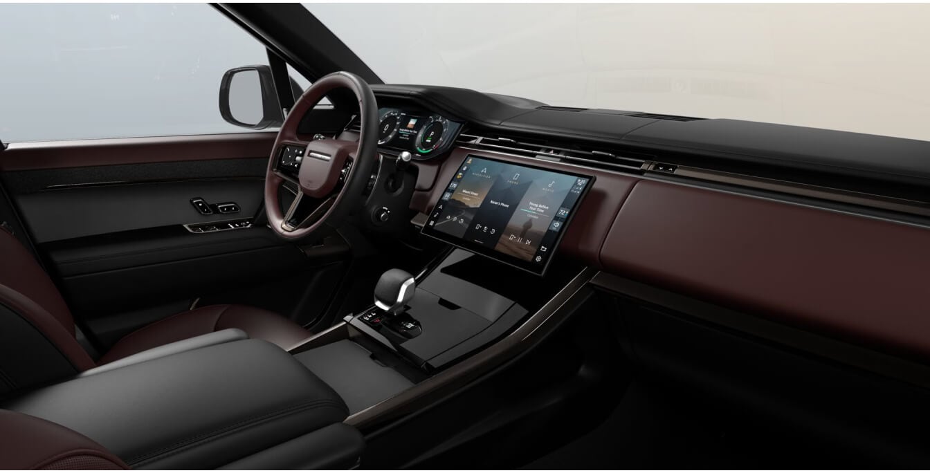 Front dashboard view of a Land Rover Range Rover Sport Dynamic SE with a Deep Garnet and Ebony leather cabin.