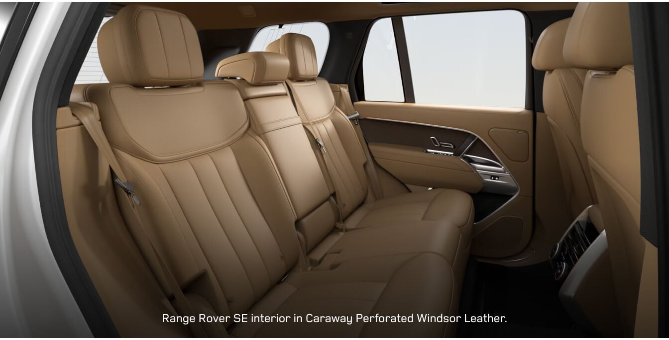 Rear passenger view of a Land Rover Range Rover SE highlighting a premium Caraway leather cabin layout.