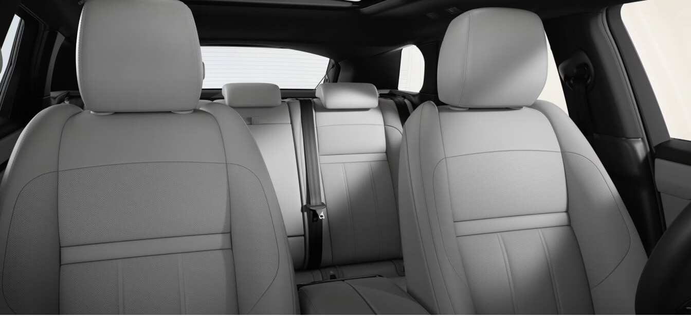 Interior cabin view of a Land Rover Range Rover Evoque S highlighting Cloud and Ebony leather seats.