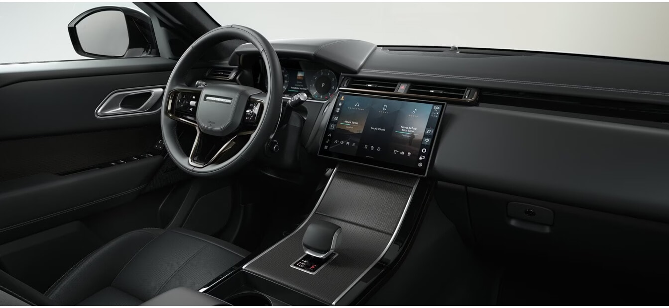 Front dashboard view of a Land Rover Range Rover Velar Dynamic SE with an Ebony leather cabin.
