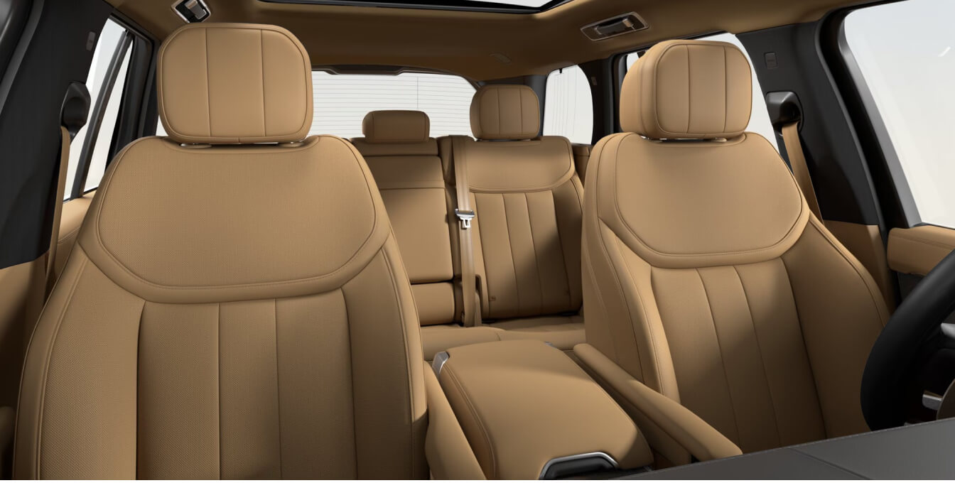 Interior cabin view of a Land Rover Range Rover SE highlighting a premium Caraway leather cabin layout.