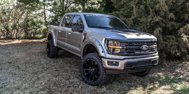 Lifted Ford F-150 Rocky Ridge truck has custom wheels, off-road tires, and fender flares made for enhanced off-road driving