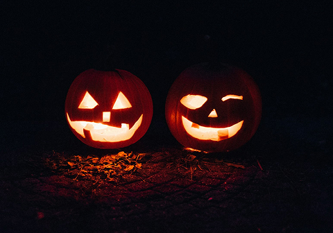 Two lighted jack-o-lanterns during night time