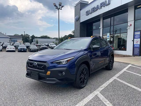 blue 2027 Subaru Crosstrek SUV parked at the MetroWest Subaru dealership in Natick, MA