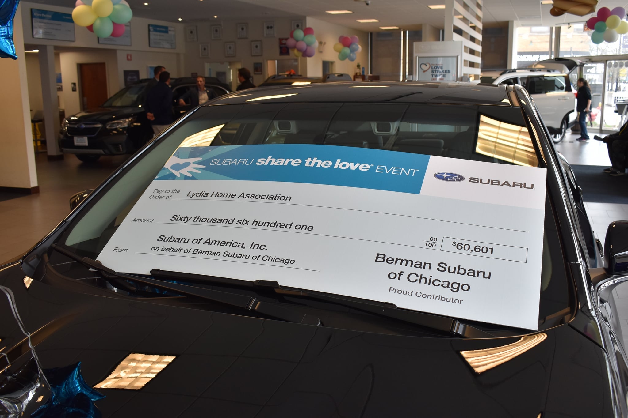 lydia home and subaru chicago check donation.jpg