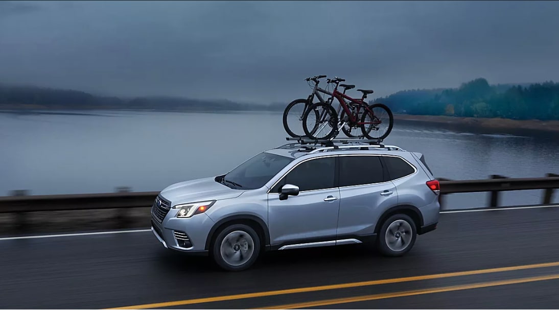 2023 Forester Touring shown in Ice Silver Metallic with accessory equipment.