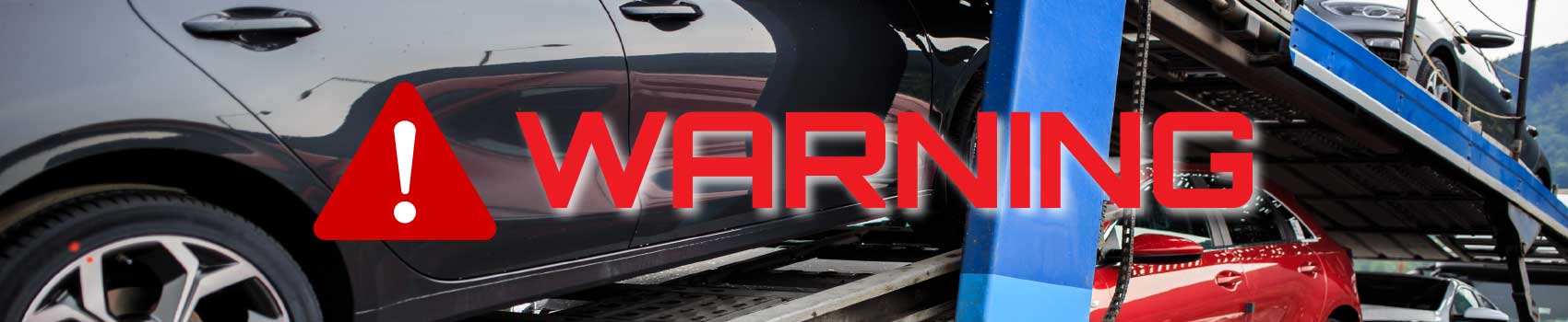 car-shipping-fraud-warning.jpg Warning sign over a car carrier truck symbolizing shipping fraud risks