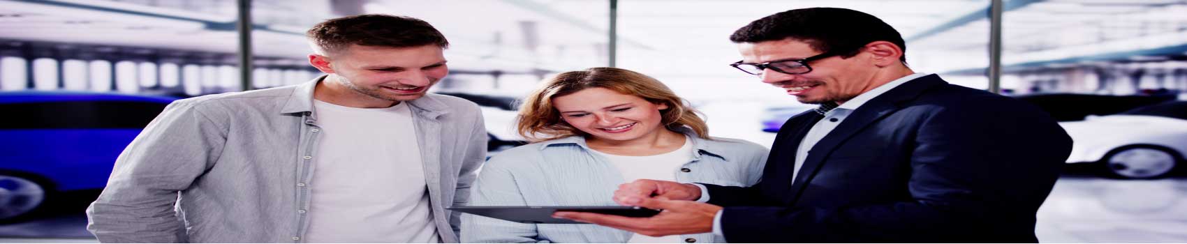 vehicle-history-report-vermont.jpg Customer reviewing a vehicle history report with a dealership representative in Vermont.