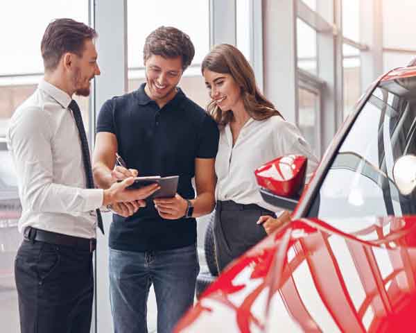  Customers compare conventional financing options with at Upper Valley Auto Mart in White River Junction Vermont