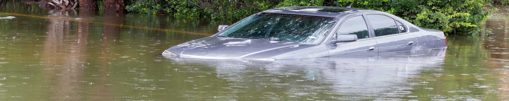 flooded-car-interior.jpg Interior of a vehicle showing water damage and mud residue